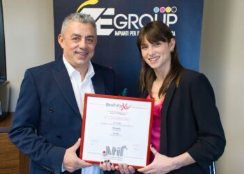 Owner, Sandro Bisoli next to co-owner Noemi Bisoli showing off the ATIF print award.