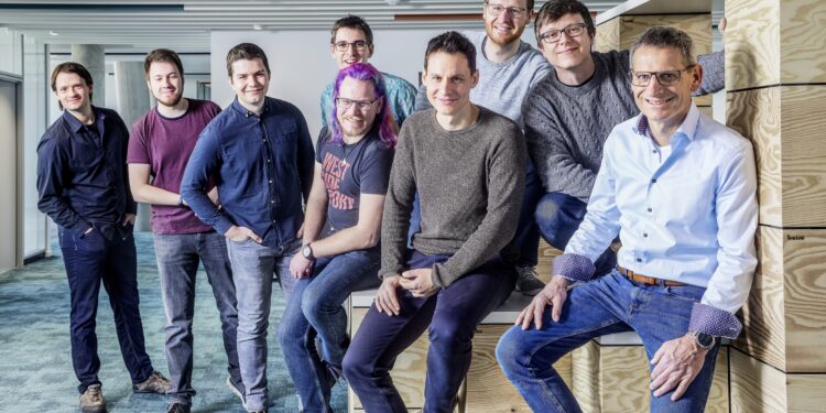 Jürgen Peters (centre), Head of Software Development at Arburg, with his Innovation Hub team in Karlsruhe. More IT and software experts are always welcome at Arburg.